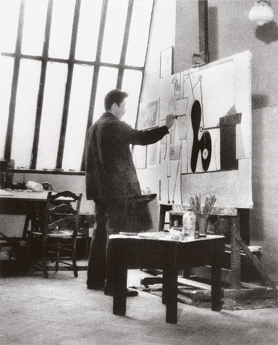 Gorky at work on&nbsp;Organization&nbsp;in his studio at 36 Union Square, New York, c. 1935. Unknown photographer. [AGCR: P146]